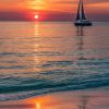 Solitary Sailing Boat In The Sunset